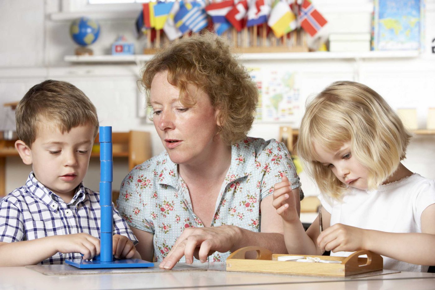 children-playing-with-teacher - Waterdown Montessori School